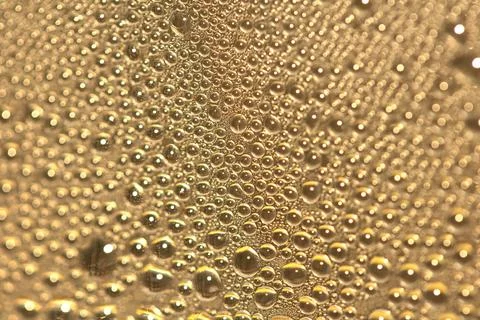 Tiny Bubbles on a Colour Background Condensation Gold Steam Water Stock Photos