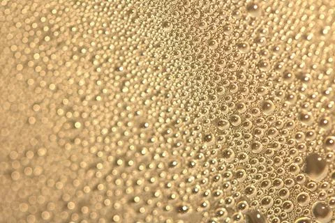 Tiny Bubbles on a Colour Background Condensation Gold Steam Water Stock Photos