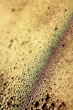 Tiny Bubbles on a Colour Background Condensation Gold Steam Water Foto stock