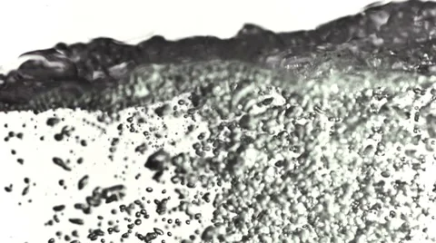Tiny bubbles moving to water surface in slow-motion Stock Footage 8576815