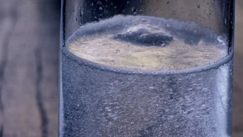 Tiny bubbles rise and burst, carrying whispers of liquid transformation Stock Footage 280178297