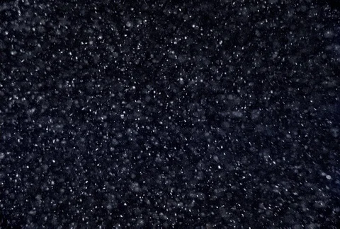 Tiny bubbles swirling and floating upward on a black background Stock Footage 86919571