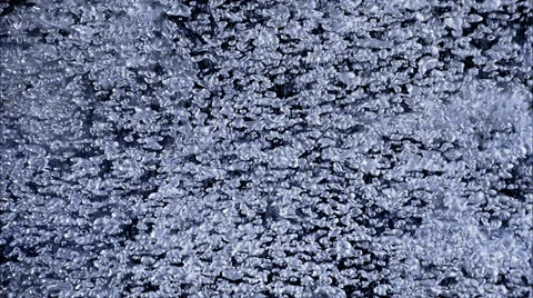 Tiny bubbles swirling in a close-up mass on a dark background Stock Footage 59529188