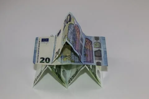 A tiny building made of different Euro banknotes Stock Photos