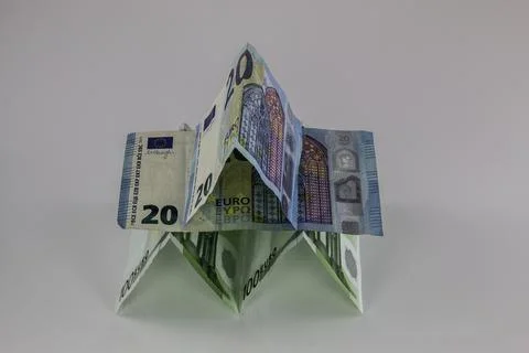 A tiny building made of different Euro banknotes Stock Photos