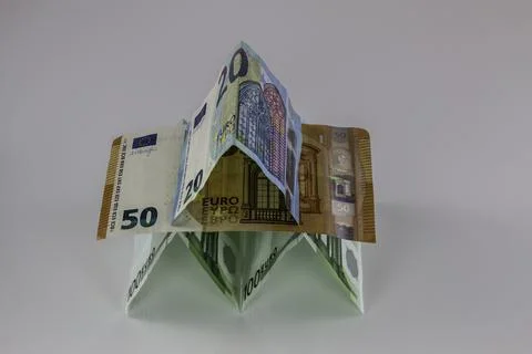 A tiny building made of different Euro banknotes Фото