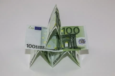 A tiny building made of different Euro banknotes Stock Photos