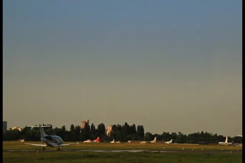 Tiny business jet takes off at sunset airport Video stock 28825971