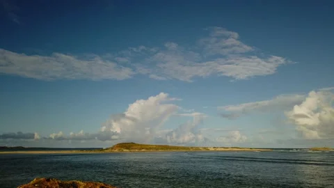 Tiny Caribbean Island with rainbow watched from Oyster Pond Timelapse 動画素材 147087892