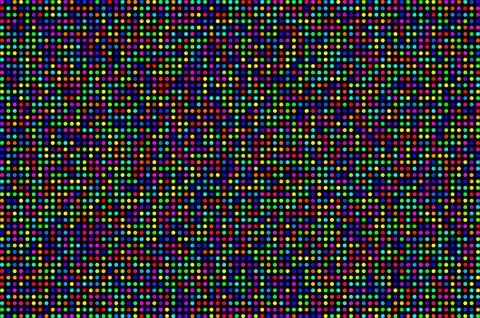 Tiny circles in various colors scattered randomly on a solid black background Fotos de archivo
