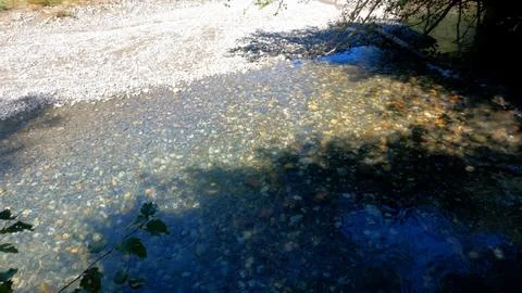 Tiny clear cold river with beach rocks in Arkhyz mountains - photo of nature Stock-Fotos