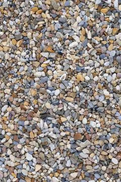 Tiny colored pebbles with visible details. background or texture Stock Photos