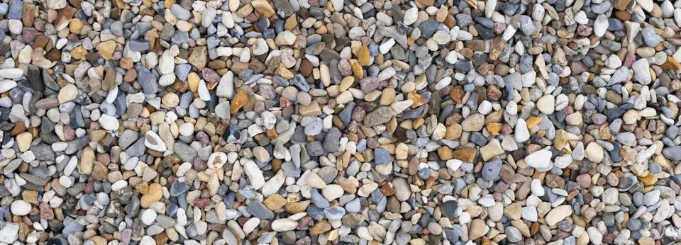 Tiny colored pebbles with visible details. background or texture 写真素材