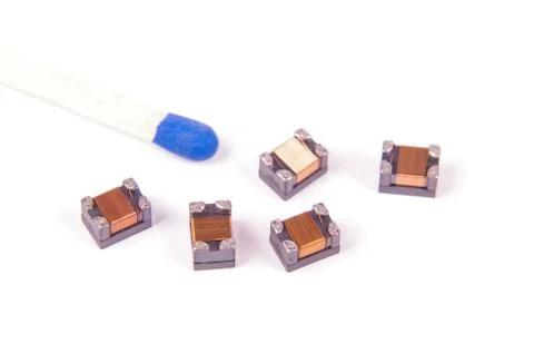 Tiny common mode choke filter in comparison with match head Stock Photos