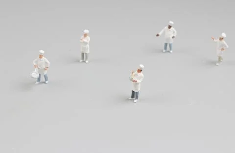 Tiny  of cook are talking in the kitchen. Stock Photos