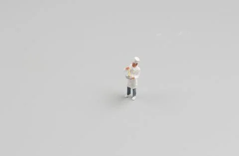 Tiny  of cook are talking in the kitchen. Stock Photos