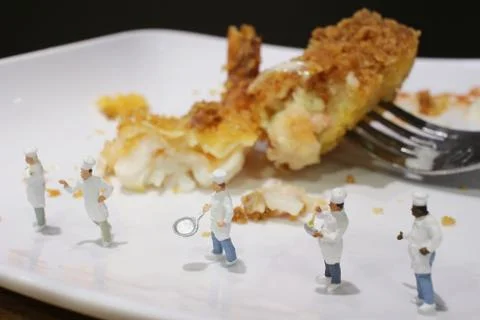 Tiny of cook are talking in the kitchen. Stock Photos