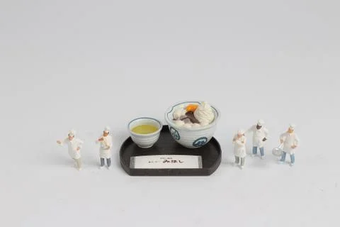 Tiny of cook are talking in the kitchen. Stock Photos