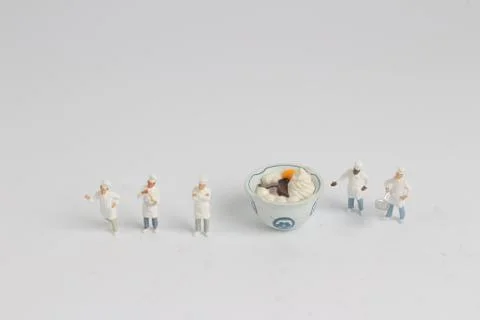Tiny of cook are talking in the kitchen. 스톡 사진