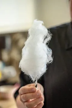 Tiny cotton candy on paper stick. Tiny cotton candy on paper stick. Copyri... 스톡 사진