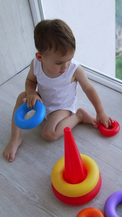 Tiny cute baby boy sitting on the floor at panoramic window Video stock 301018949