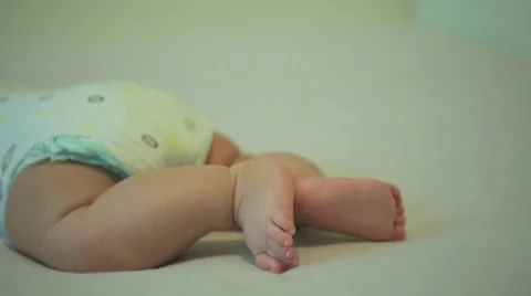 Tiny cute feet of an active newborn baby Stock Footage 53001483