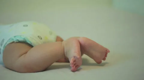 Tiny cute feet of an active newborn baby Stock Footage 53001489