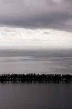 Tiny Dam Leading through the Ocean in a Storm Stock Photos