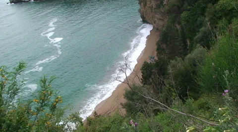 Tiny deserted beach in Montenegro rocky shore Stock Footage 33355119