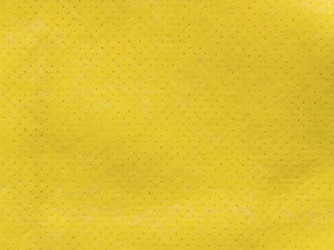 Tiny dotted yellow fabric textile textured Stock Photos