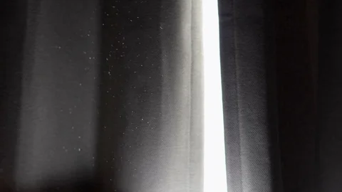 Tiny Dust Particles From The Sunlight Floating In The Air Through The Video stock 128762798