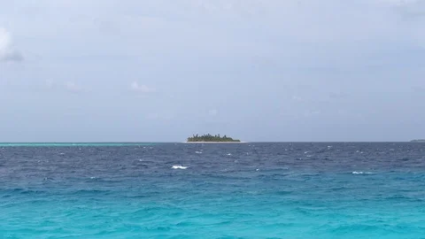 Tiny exotic island in the ocean at windy weather. Maldives Stock Footage 119172118