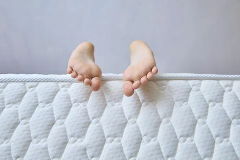 Tiny Feet Explore Comfort And Playfulness. Copy space Stock Photos