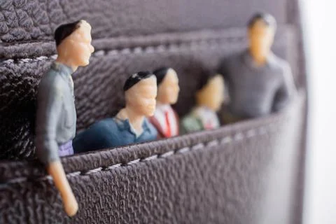 Tiny figurine of group of men miniature model in pockets 스톡 일러스트