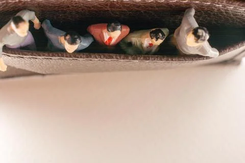 Tiny figurine of group of men miniature model in pockets 스톡 일러스트