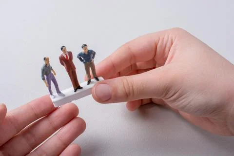 Tiny figurines of men model  in view Stock Photos