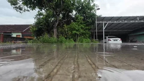 Tiny flooding on asian road Stock Footage 333828301