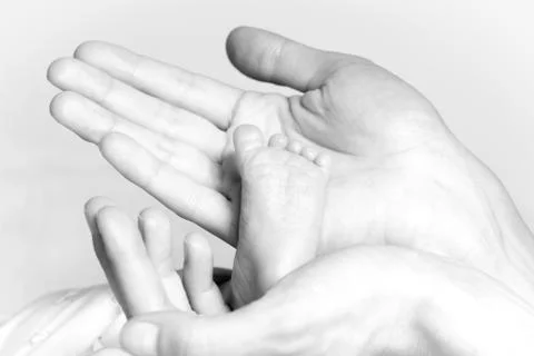 Tiny foot Stock Photos