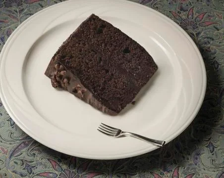 Tiny fork with chocolate cake Stock Photos