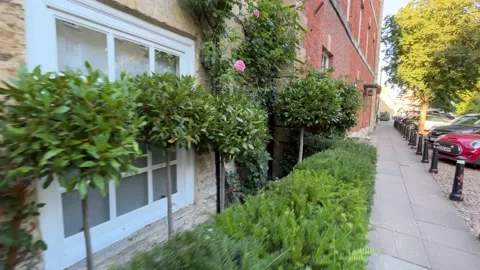 Tiny front garden in a traditional English town - gimbal walk Stock Footage 221874182