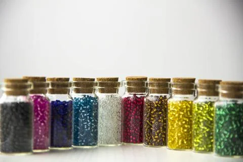 Tiny glass bottles filled with beads Tiny glass bottles filled with beads ... 库存照片