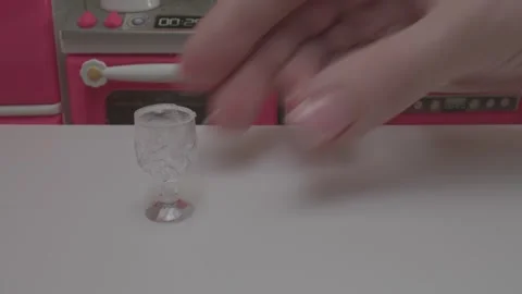 Tiny Glass Cup Placed in Play Kitchen Toy Set Video stock 274150090