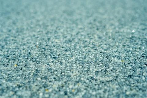 Tiny gravel texture on blue light concrete wall. Texture background seamless 写真素材