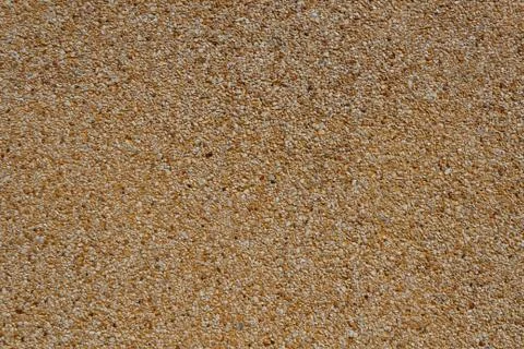 Tiny gravel texture on brown wall texture Stock Photos