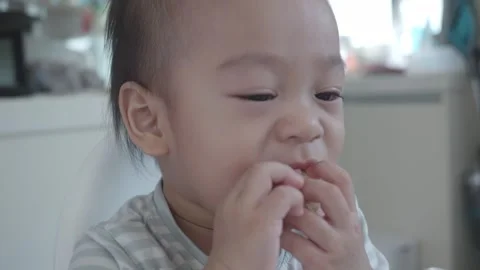 Tiny Hands Enjoying a Snack Stock Footage 345662227