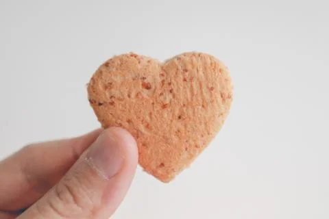 Tiny heart shape of bread. Concept of love and care in Valentine day. Stock-Fotos