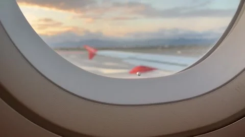 The tiny hole in an airplane window is called a bleed hole or breather hole Stock Footage 342873380
