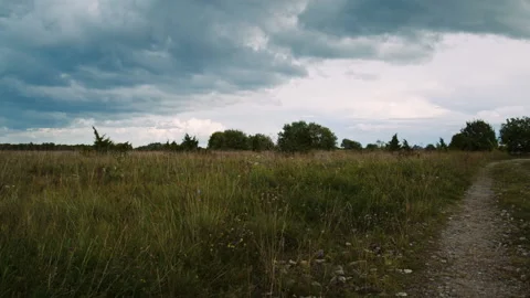 Tiny house along the dirt road in the countryside. Panning Video stock 147407198