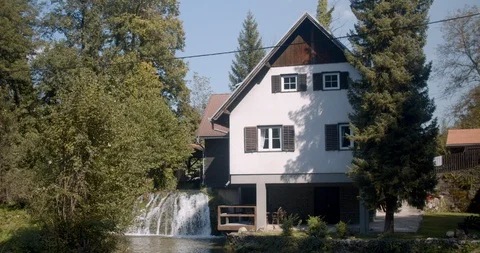 Tiny house in croatia on a small waterfall Stock Footage 122831626