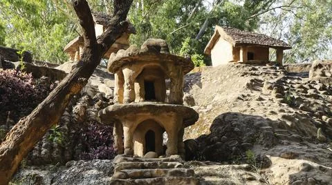 Tiny huts built from rocks inside the Rock Garden, Chandigarh, India. Stock Photos